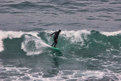 Man surfing in sea