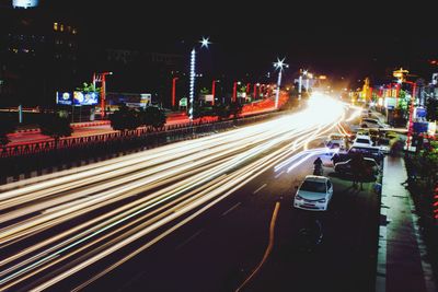 High angle view of light trails on city street at night