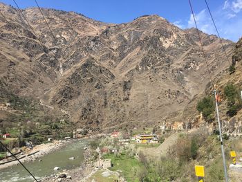 High angle view of road amidst mountains against sky