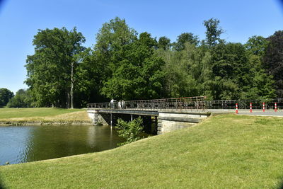 Bridge over lake against sky