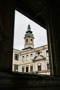 Low angle view of old building against sky