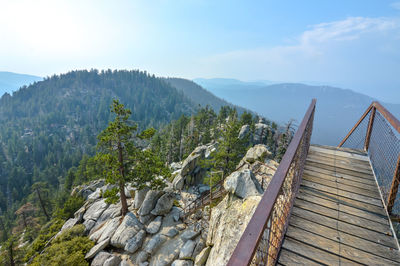 Footbridge on mountain during foggy weather