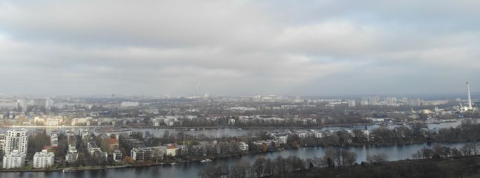 Panoramic view of river and buildings against sky