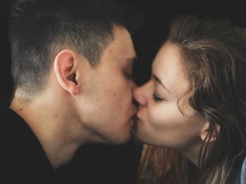 Close-up portrait of couple kissing