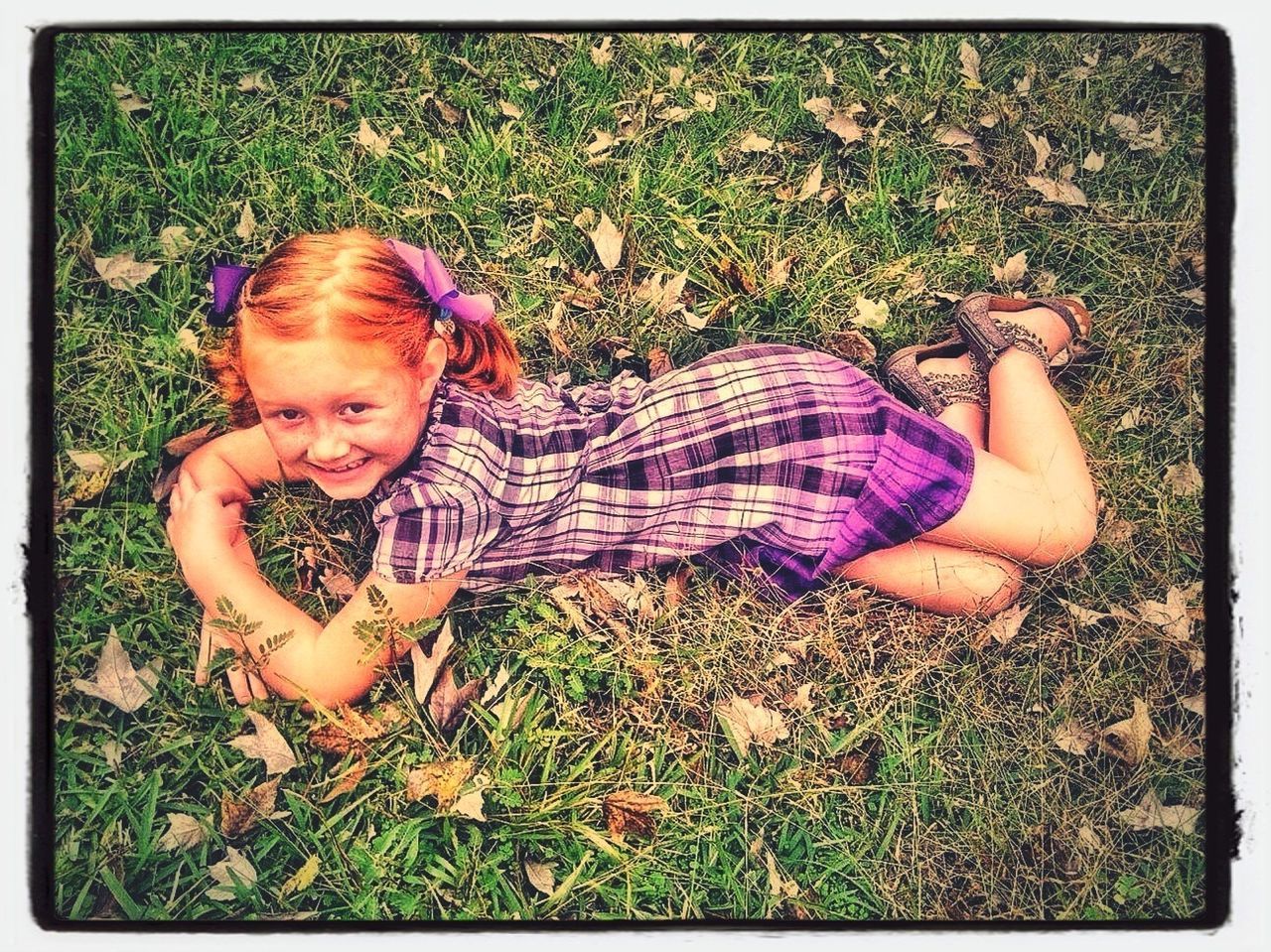 transfer print, grass, person, childhood, auto post production filter, elementary age, high angle view, lifestyles, leisure activity, cute, relaxation, grassy, lying down, field, innocence, girls, looking at camera, portrait