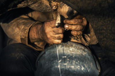 Close-up of man working statue