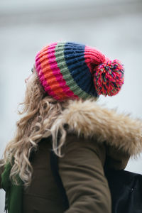 Winter portrait of a woman wearing colorful hat