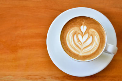 High angle view of cappuccino on table
