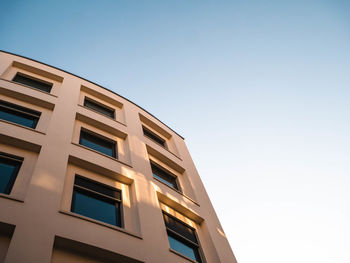 Low angle view of modern building against clear sky