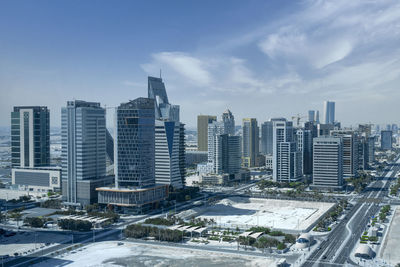 Modern designed towers constructed at lusail city with clear blue cloudy sky