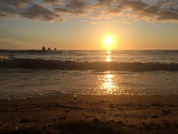 Scenic view of sea at sunset