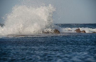 Waves splashing on rocks