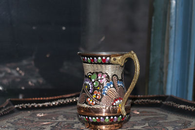 Close-up of antique container at market stall