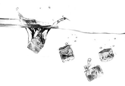 Close-up of water over white background