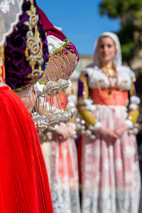 People in traditional clothing standing outdoors