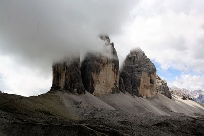 Panoramic view of rocky mountains against sky
