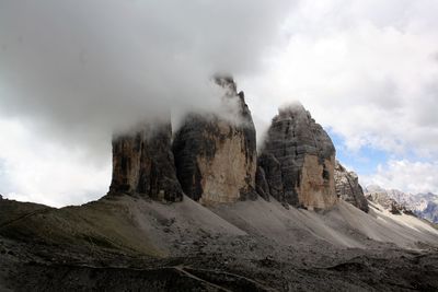 Panoramic view of rocky mountains against sky