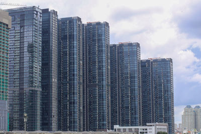 High-rise apartment buildings line the saigon river, ho chi minh city, vietnam