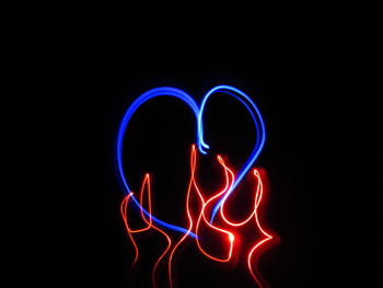 Close-up of light painting against black background