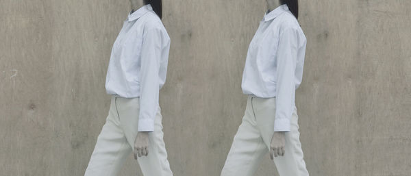 Multiple image of woman walking against wall