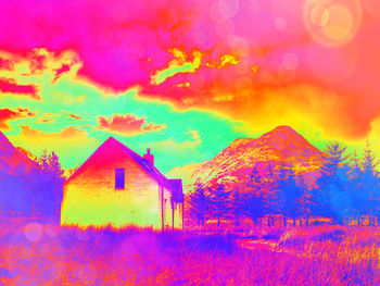 Digital composite image of multi colored building against sky during sunset