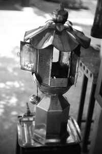 Close-up of bell hanging from metal container