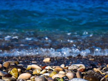 Close-up of pebbles at seashore