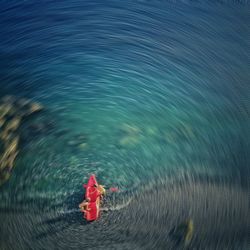 High angle view of red toy floating on water