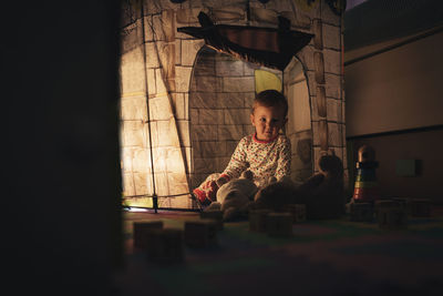 Portrait of boy playing at home