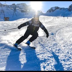 Full length of person skiing on snowcapped mountain during winter