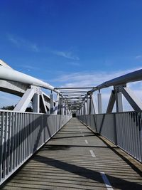 Bridge over footbridge against sky
