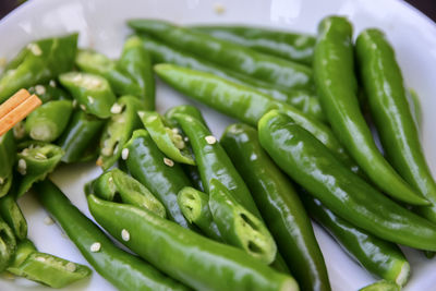 Close-up of green chili peppers in plate