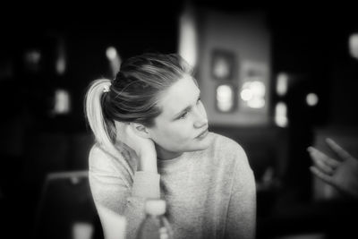 Close-up of woman sitting outdoors