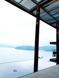 Scenic view of sea against sky seen through window