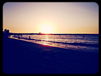 Scenic view of sea at sunset