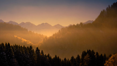 Scenic view of mountains against sky during sunset