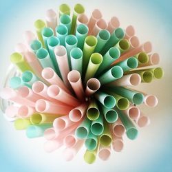 Close-up of drinking straws on table