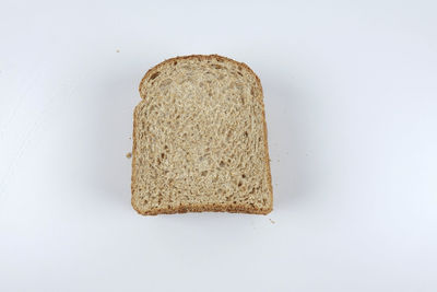 Close-up of bread against white background