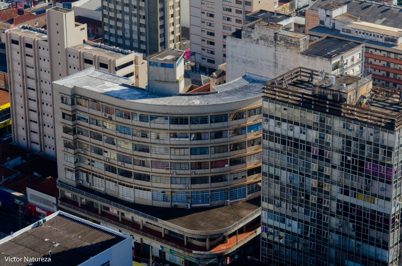 architecture, building exterior, built structure, skyscraper, city, modern, high angle view, day, window, outdoors, cityscape, no people, apartment