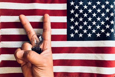 High angle view of hand holding flag