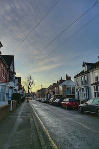 Street amidst buildings against sky