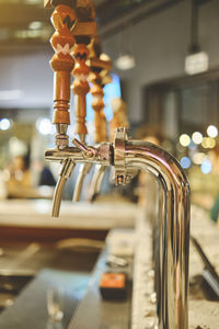 Row of draft beer taps at a bar. beer taps in a row in perspective. close up of beer tap. 