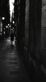 Woman walking on street in city