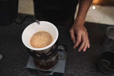 High angle view of coffee cup on table