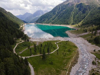 High angle view of river and the lake amidst mountains
