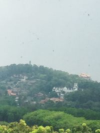 Scenic view of landscape against sky during rainy season