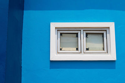 Close-up of blue window of house