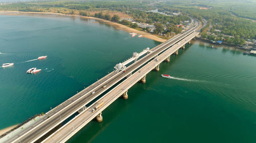 High angle view of bridge over sea in city