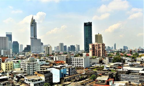 Modern buildings in city against sky