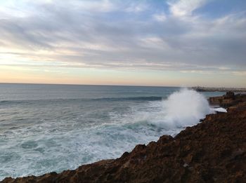 Scenic view of sea against dramatic sky